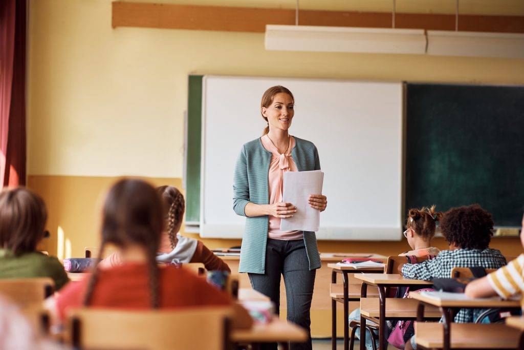 happy-elementary-school-teacher-giving-lecture-to-2022-11-16-14-47-56-utc-1024x683.jpg